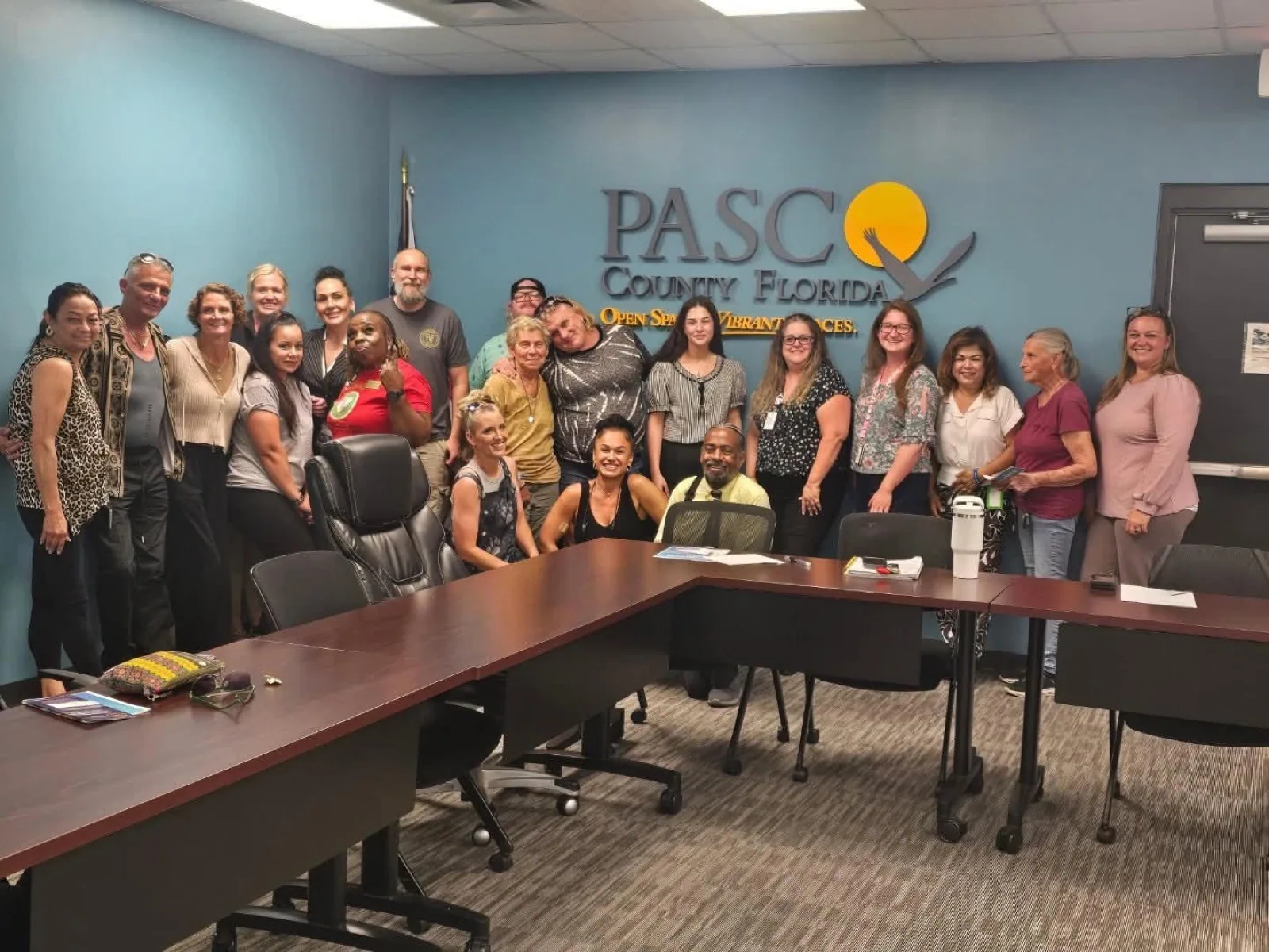 A group gathered in a Pasco County, Florida meeting room